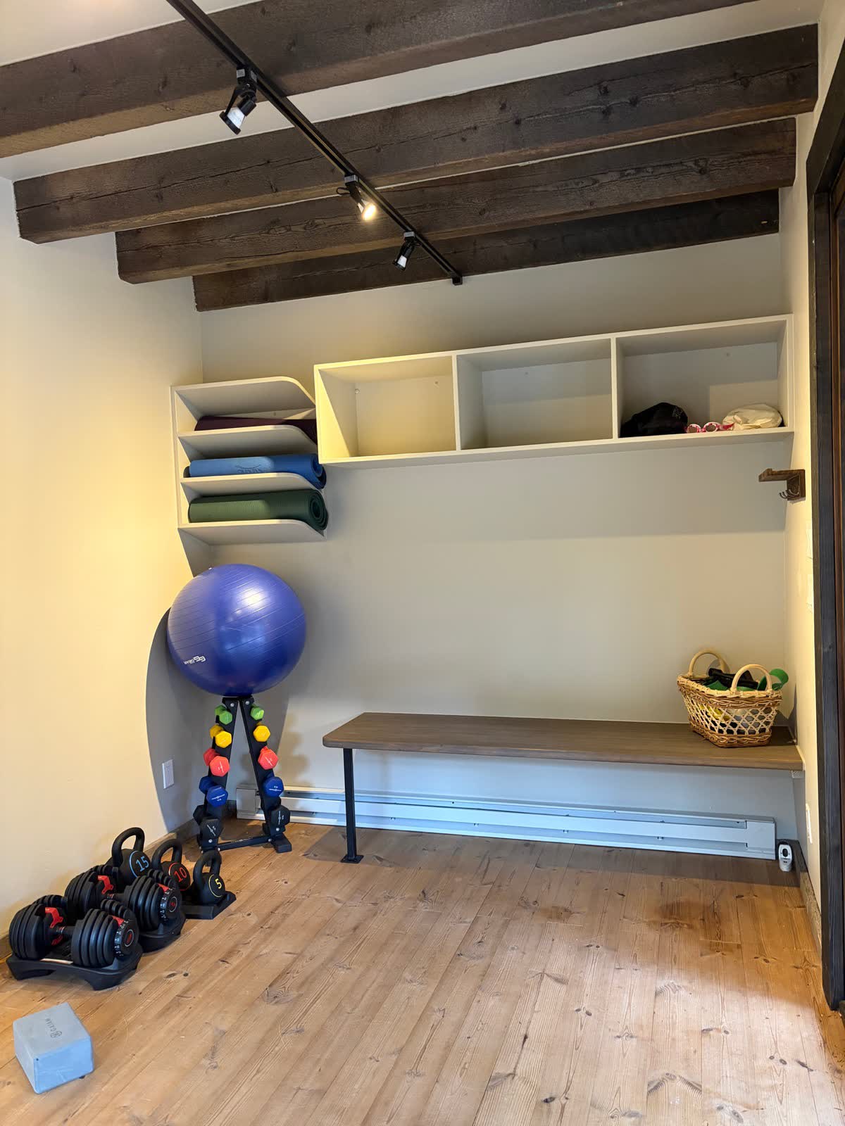 The Motion Studio with a bike, mats and weights